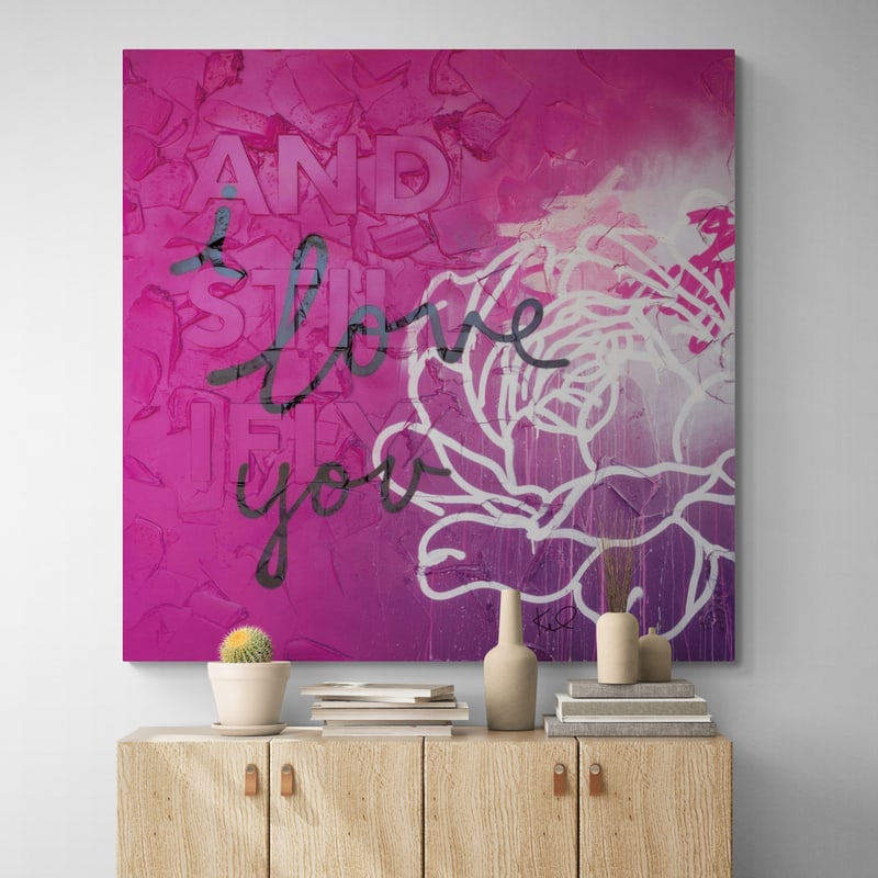 And Still I Fly Sq by Kent Youngstrom wall art in a hallway
