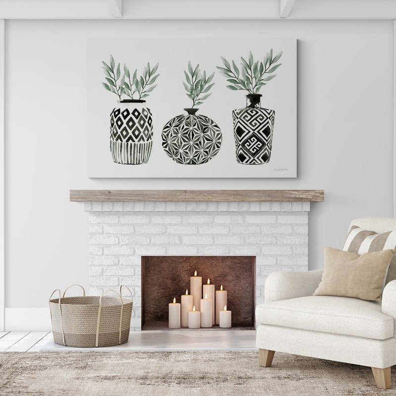 Geometric Vases I Green by Mercedes Lopez Charro wall art in a living room