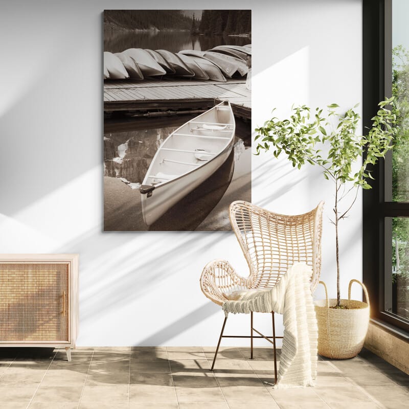 Moraine Lake Canoe by Alan Majchrowicz wall art in a living room
