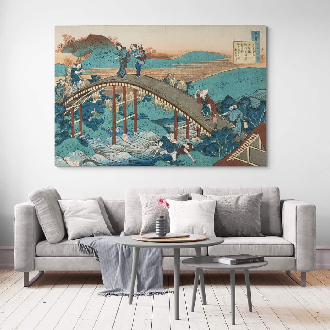 People Crossing An Arched Bridge by Katsushika Hokusai wall art in a living room