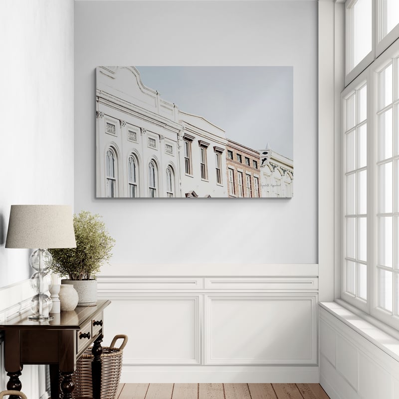 Row Houses by Elizabeth Urquhart wall art in a hallway